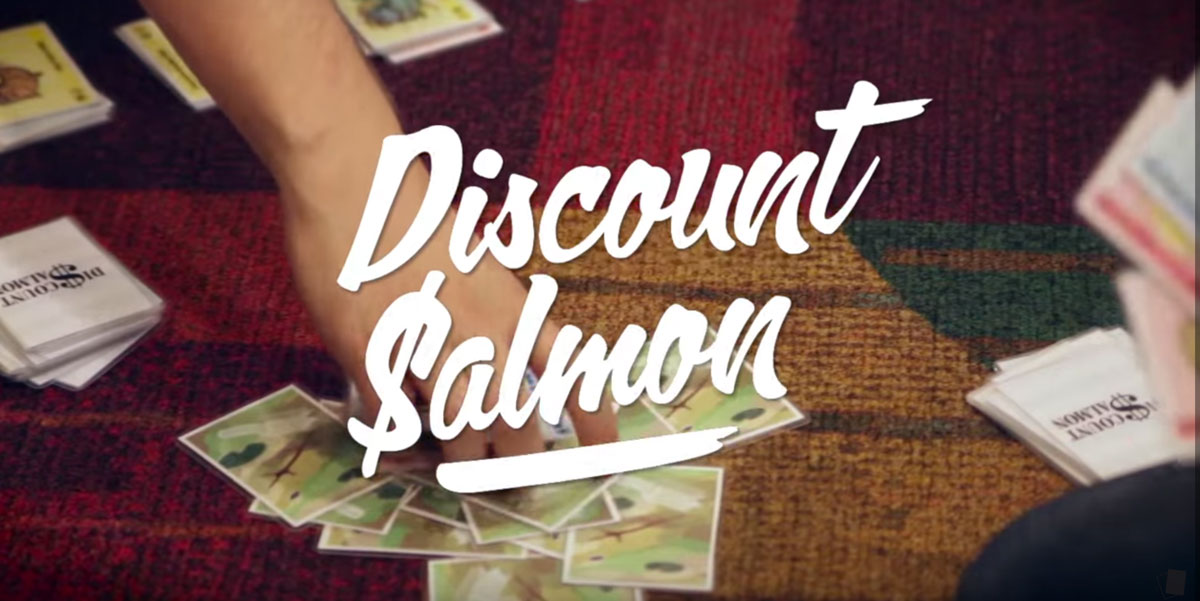 Discount Salmon logo with people playing the game in the background